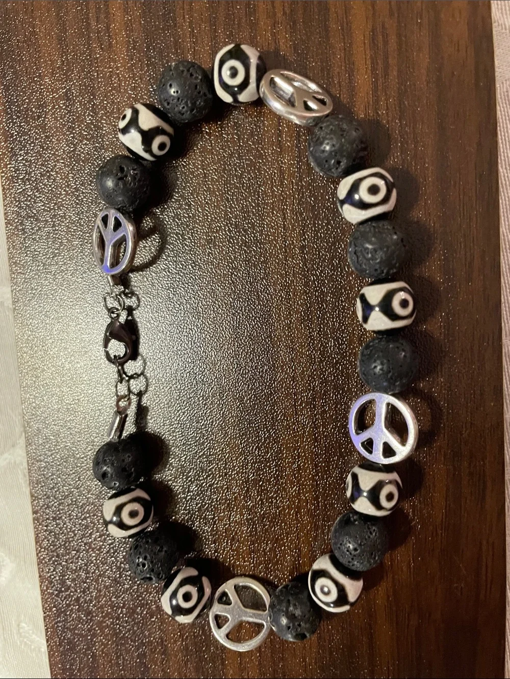 9-Bead Tibetan polish bead Anklet with lava beads and peace signs.